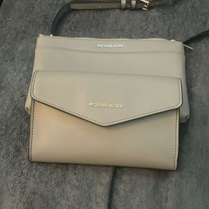 Never worn Michael Kors purse/clutch set